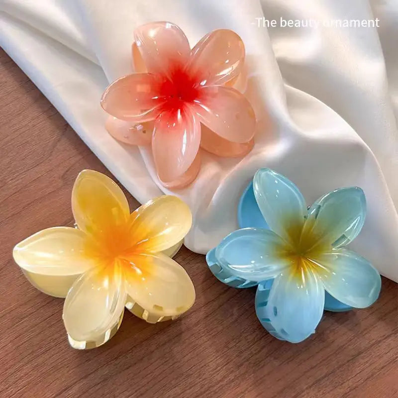 🌺 Pince Fleur Hawaïenne – L’Accessoire Tendance de l’Été ✨